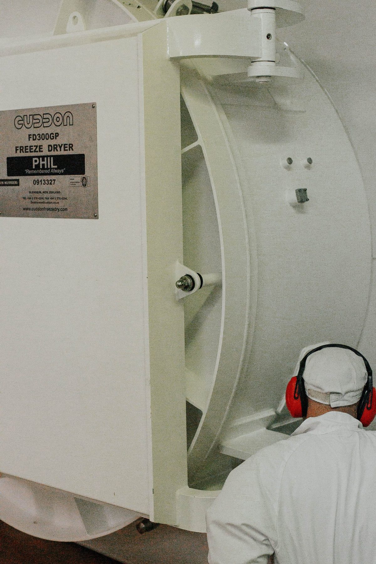 Operator working at a Cuddons freeze dryer at Back Country Foods